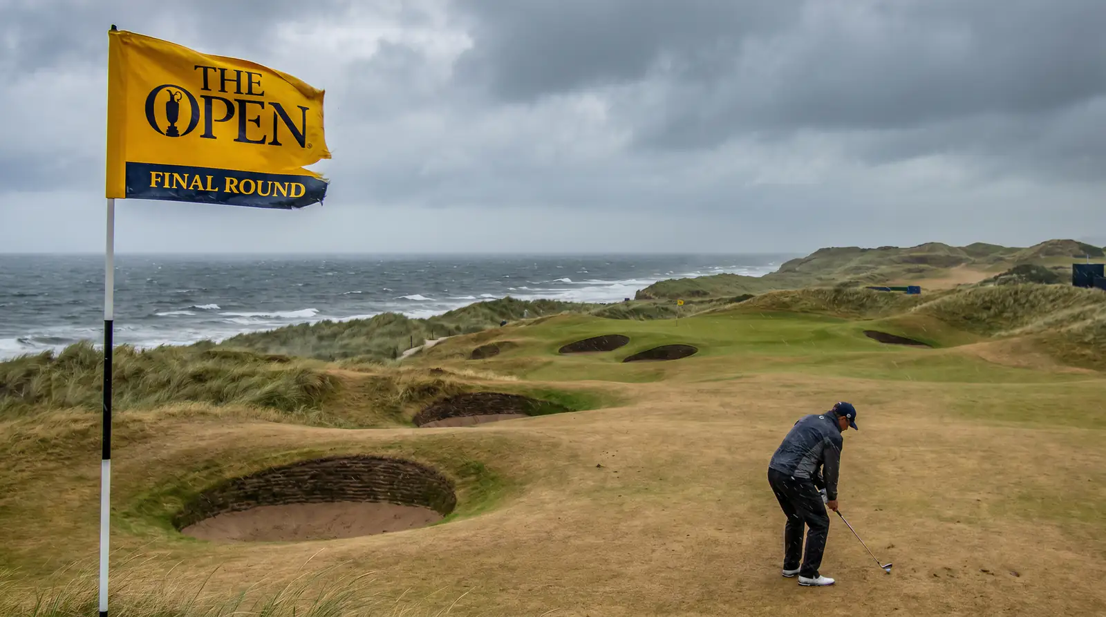 Final-round play on a links course at The Open Championship under late summer light.